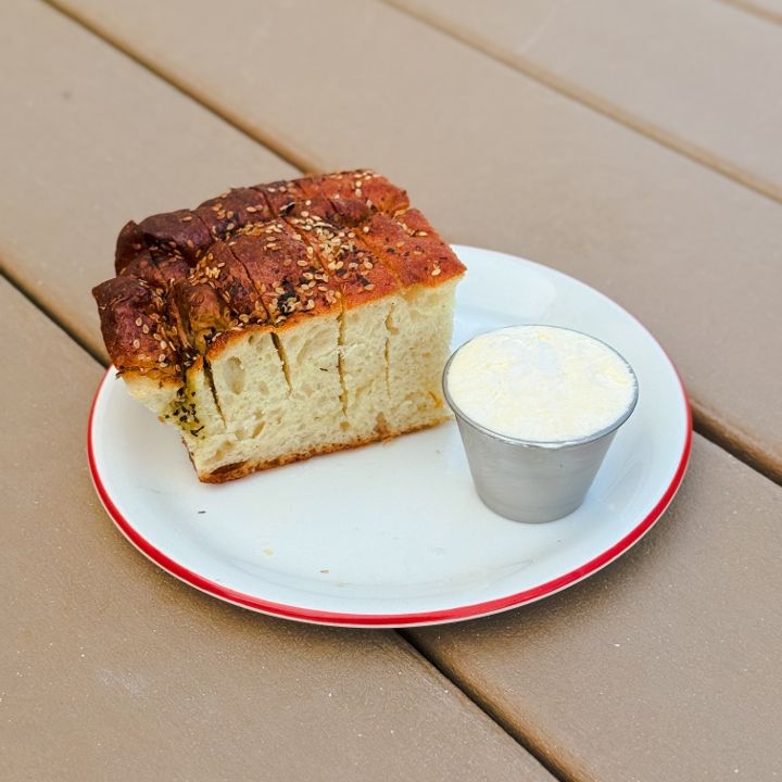 Loudmouth signature dishes Warm Seeded Focaccia, Loudmouth Club, Hot Boy Summer.